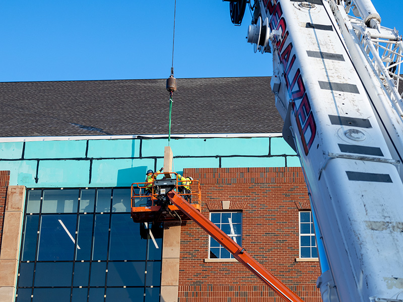 Stone being lowered by crane