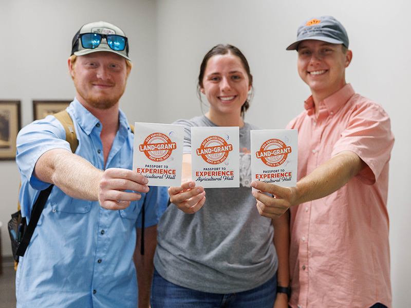 Students holding passports during teaching day