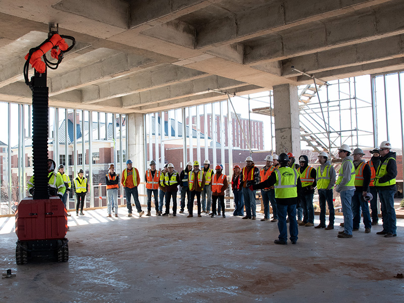 OSU students watch jaibot robot on construction site
