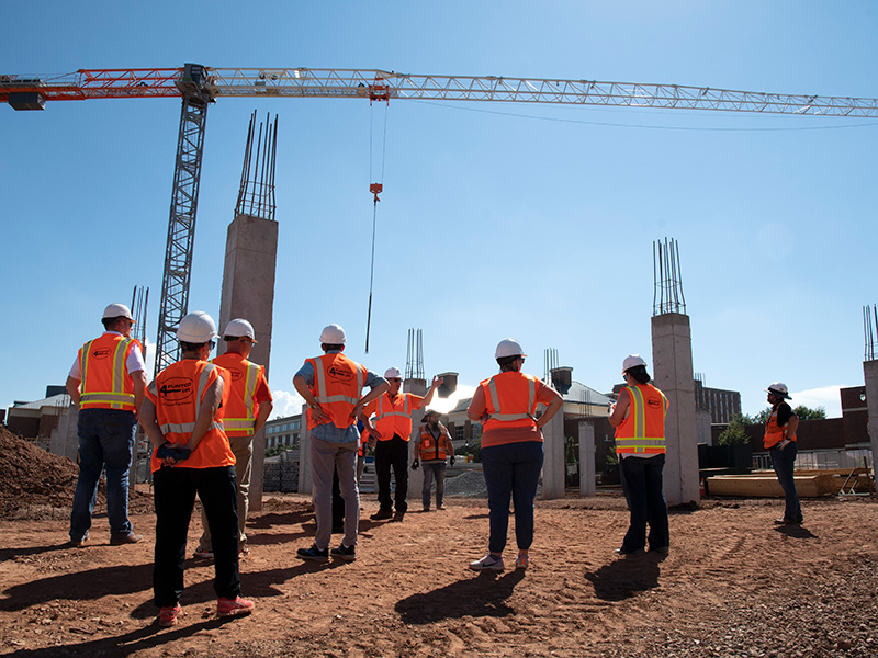 faculty and staff viewing the crane