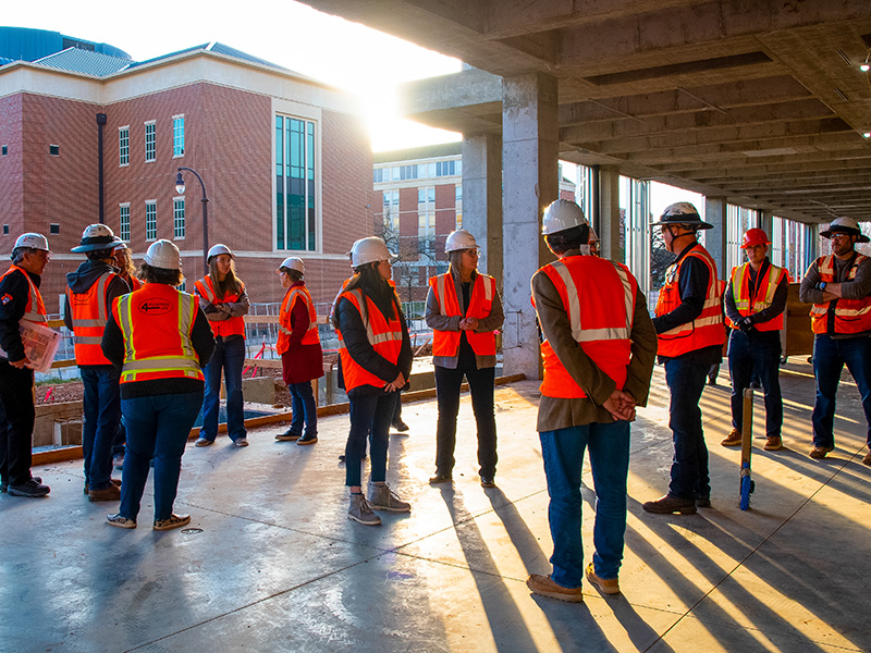 Group of people on a construction site. 