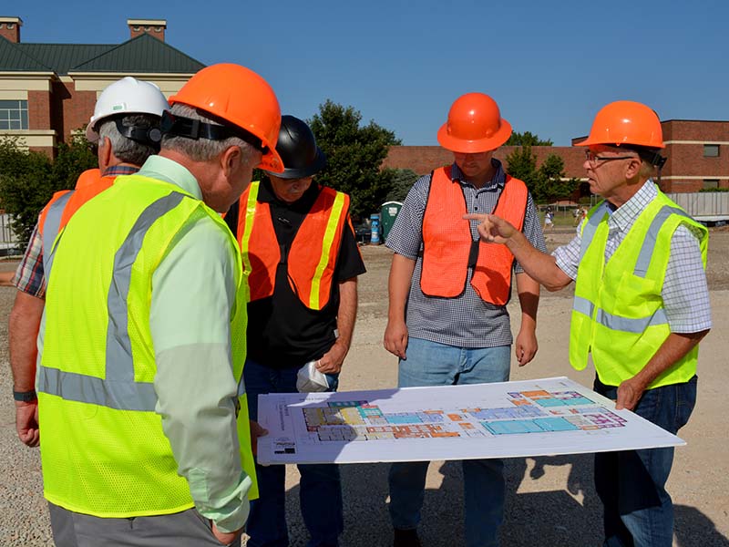 Group looking at floor map for the facility