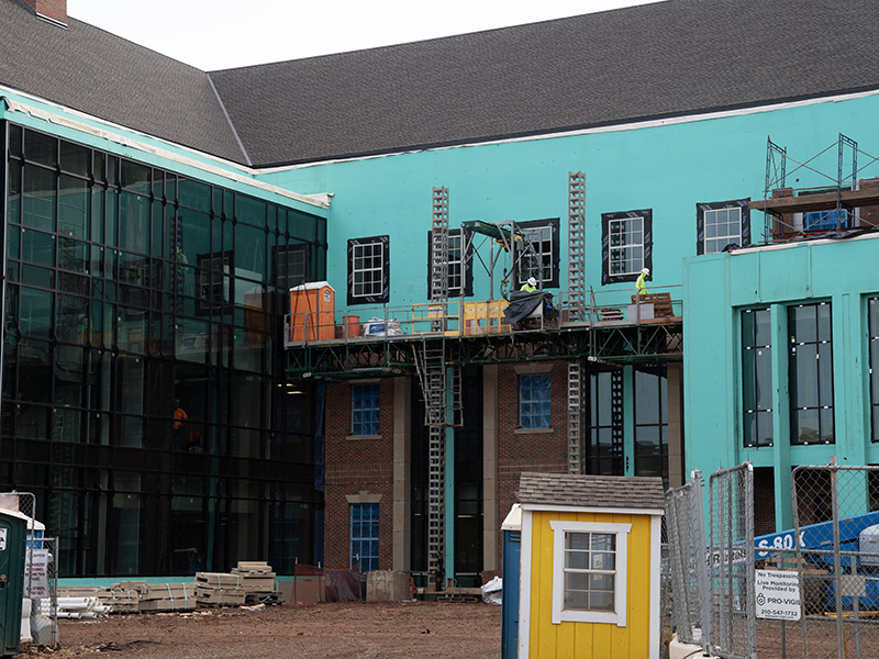 Installing brick on front of building