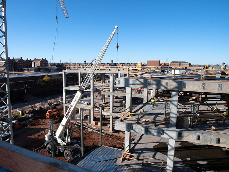 two cranes being utilized on the construction site